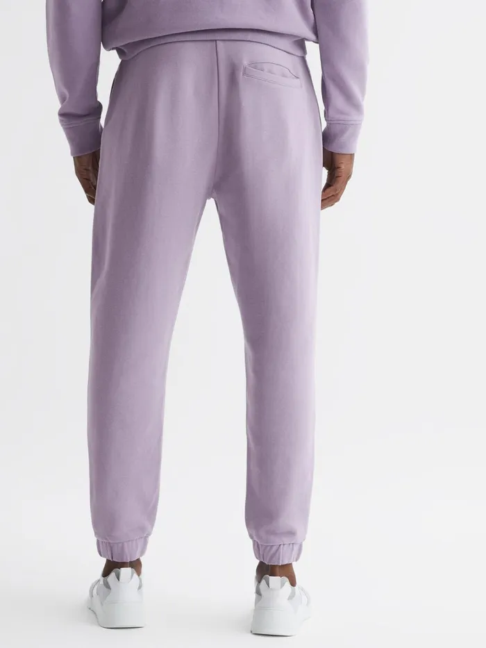 Men Ali Garment Dye Joggers Lilac Reiss Trousers
